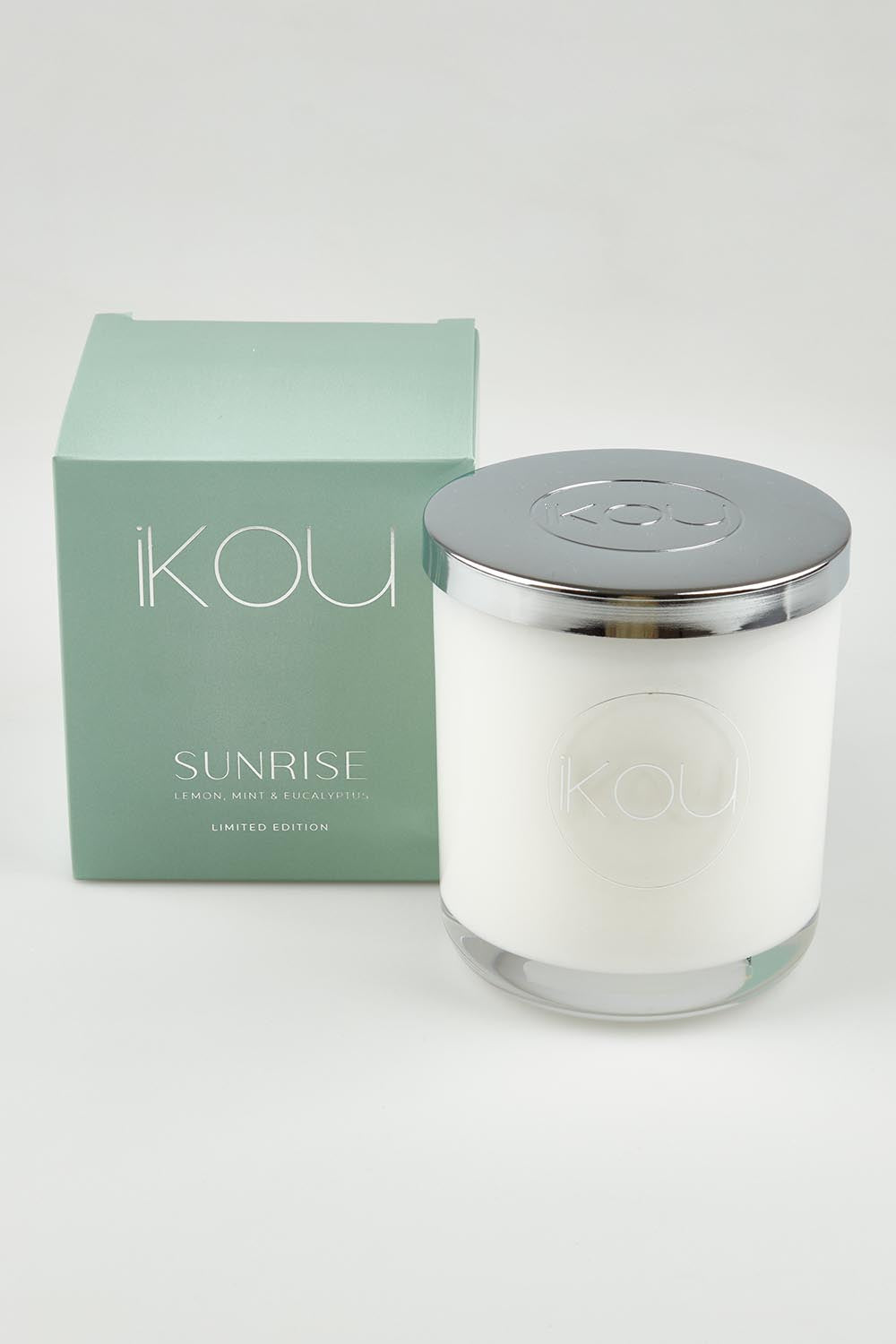 A model wearing the Limited Edition Candle in colour Sunrise (Green), from the front, showing the whole outfit