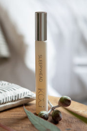 A model wearing the Aromatherapy Rolette in colour Sleepyhead (White), from the front, showing the whole outfit