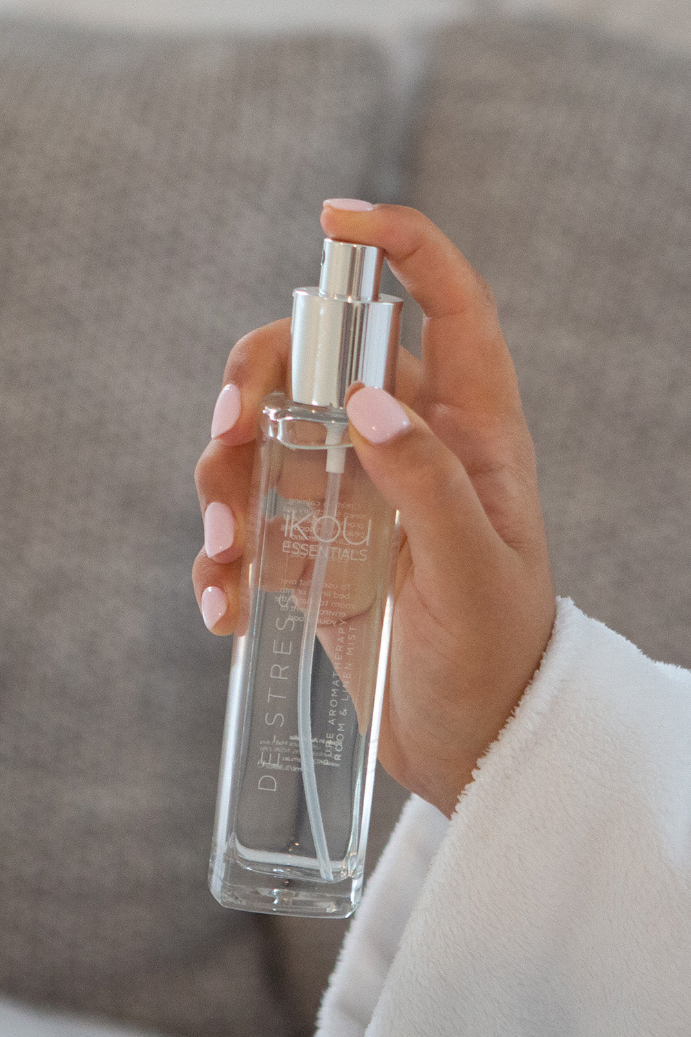 A model wearing the Aromatherapy Room And Linen Mist in colour Destress (White), from the front, showing the whole outfit