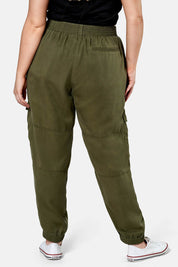 A model wearing the Cecily Cargo Joggers in colour Khaki (Green), from the back