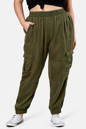 A model wearing the Cecily Cargo Joggers in colour Khaki (Green), from the front, cropped image