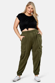 A model wearing the Cecily Cargo Joggers in colour Khaki (Green), from the front, showing the whole outfit