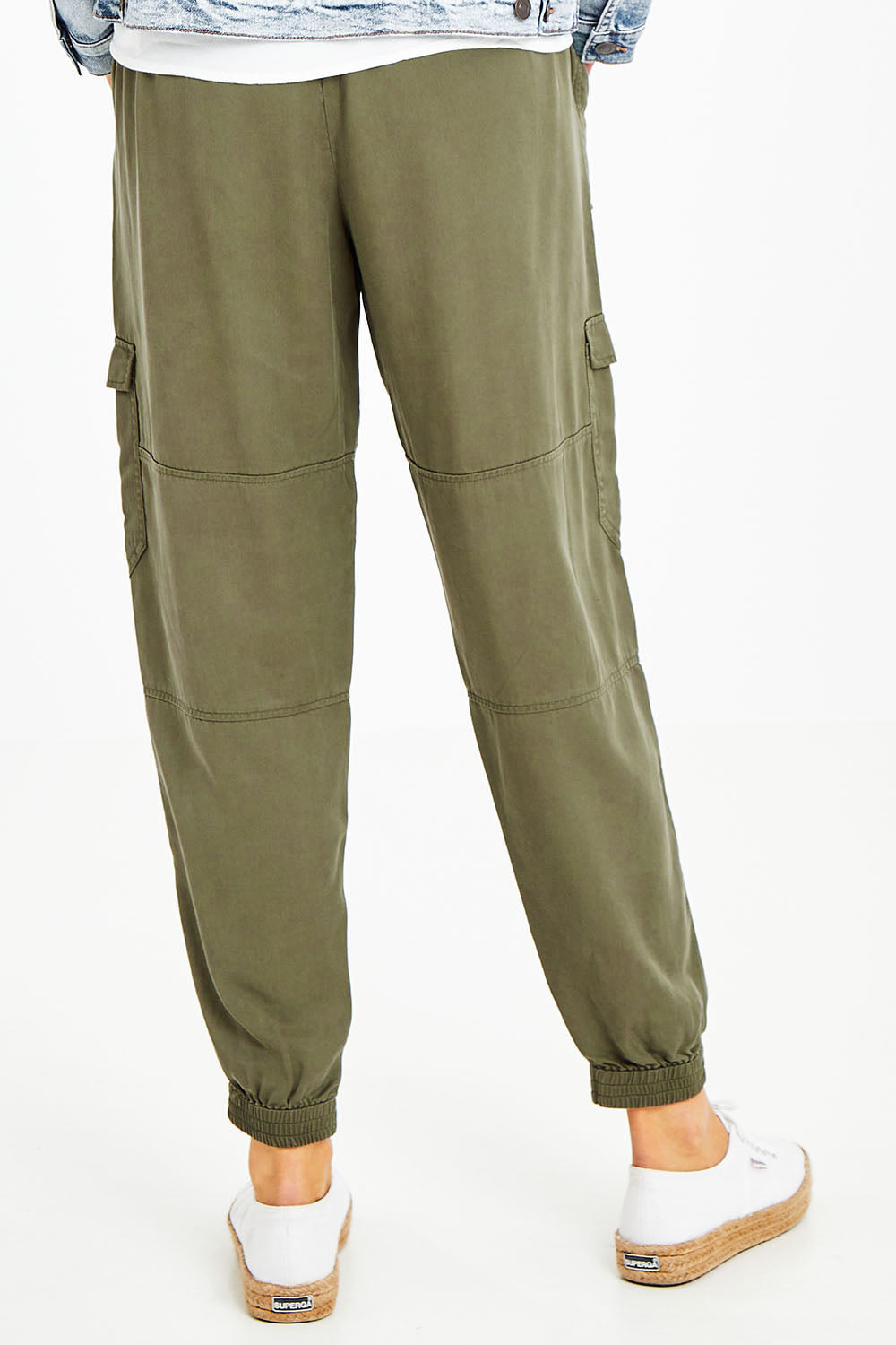 Model Naomi wearing size 10 of the Cecily Cargo Joggers in colour Khaki (Green), from the back