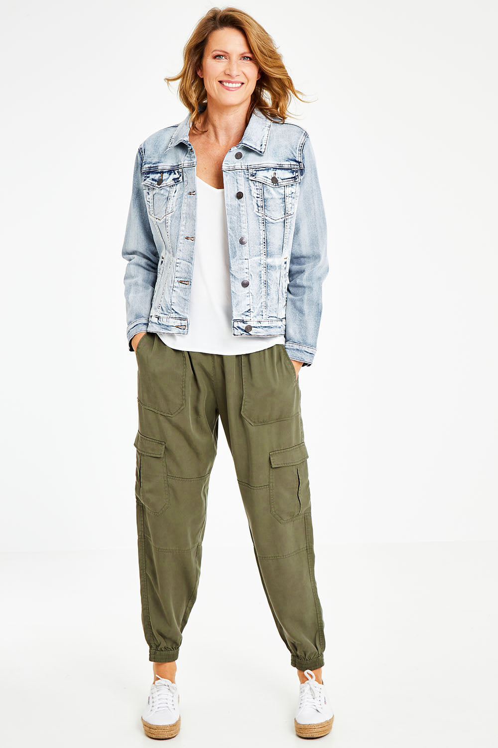 Model Naomi wearing size 10 of the Cecily Cargo Joggers in colour Khaki (Green), from the front, showing the whole outfit