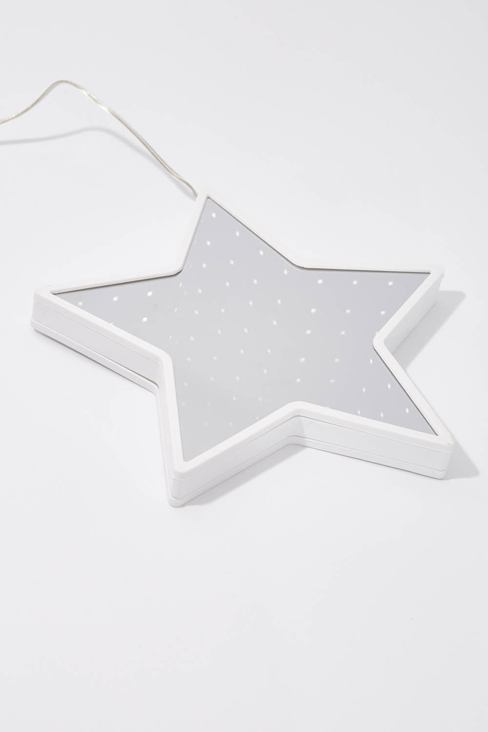 A model wearing size OneSize of the Infinity Light Hanging Christmas Star in colour White (White), from the front, showing the whole outfit