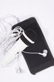 A model wearing size OneSize of the 2.0 Smart Phone Karaoke in colour White (White), from the front, showing the whole outfit