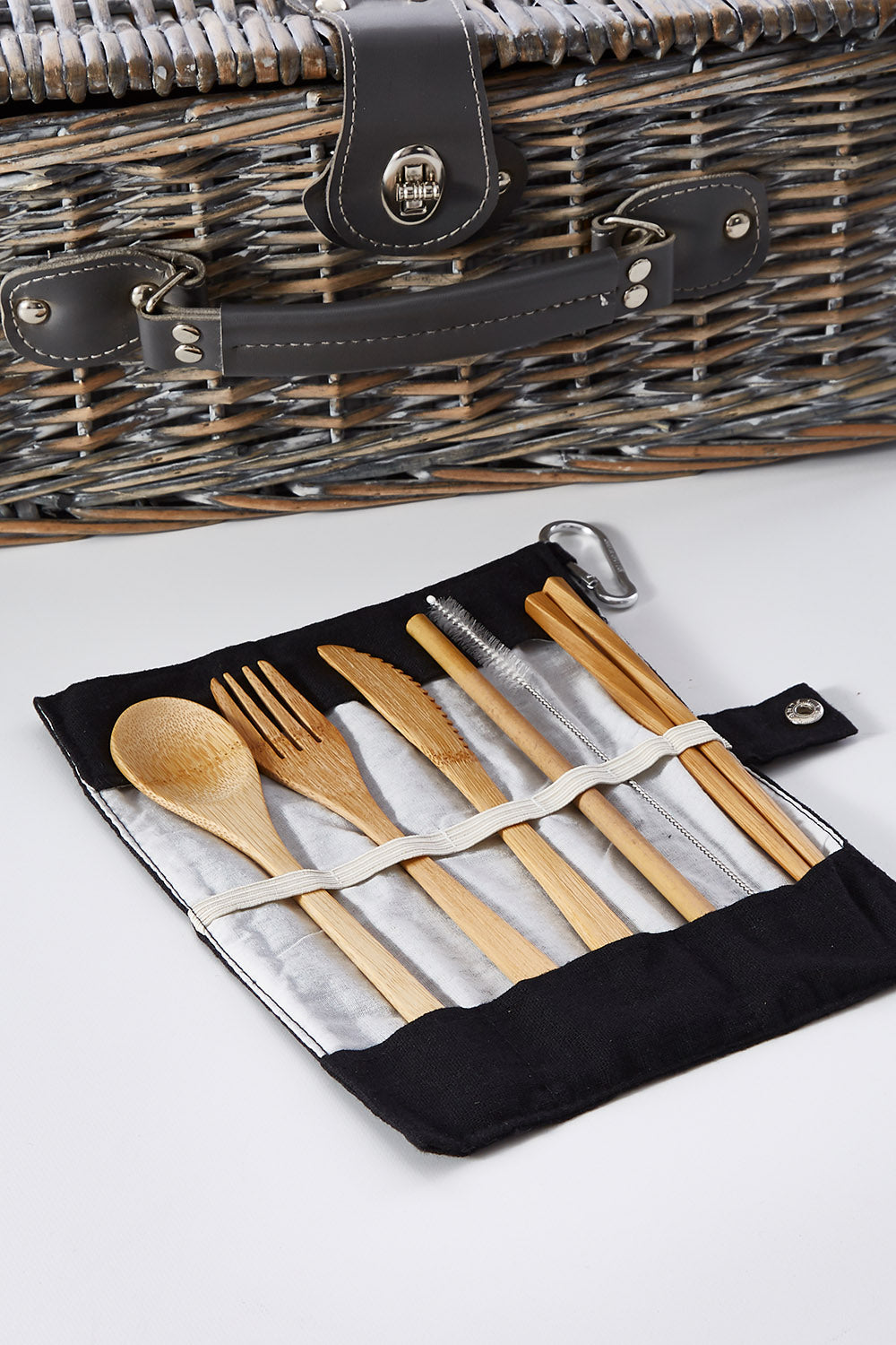 A model wearing size OneSize of the Bamboo Travel Cutlery Set With Carabiner in colour Black (Black), from the front, showing the whole outfit