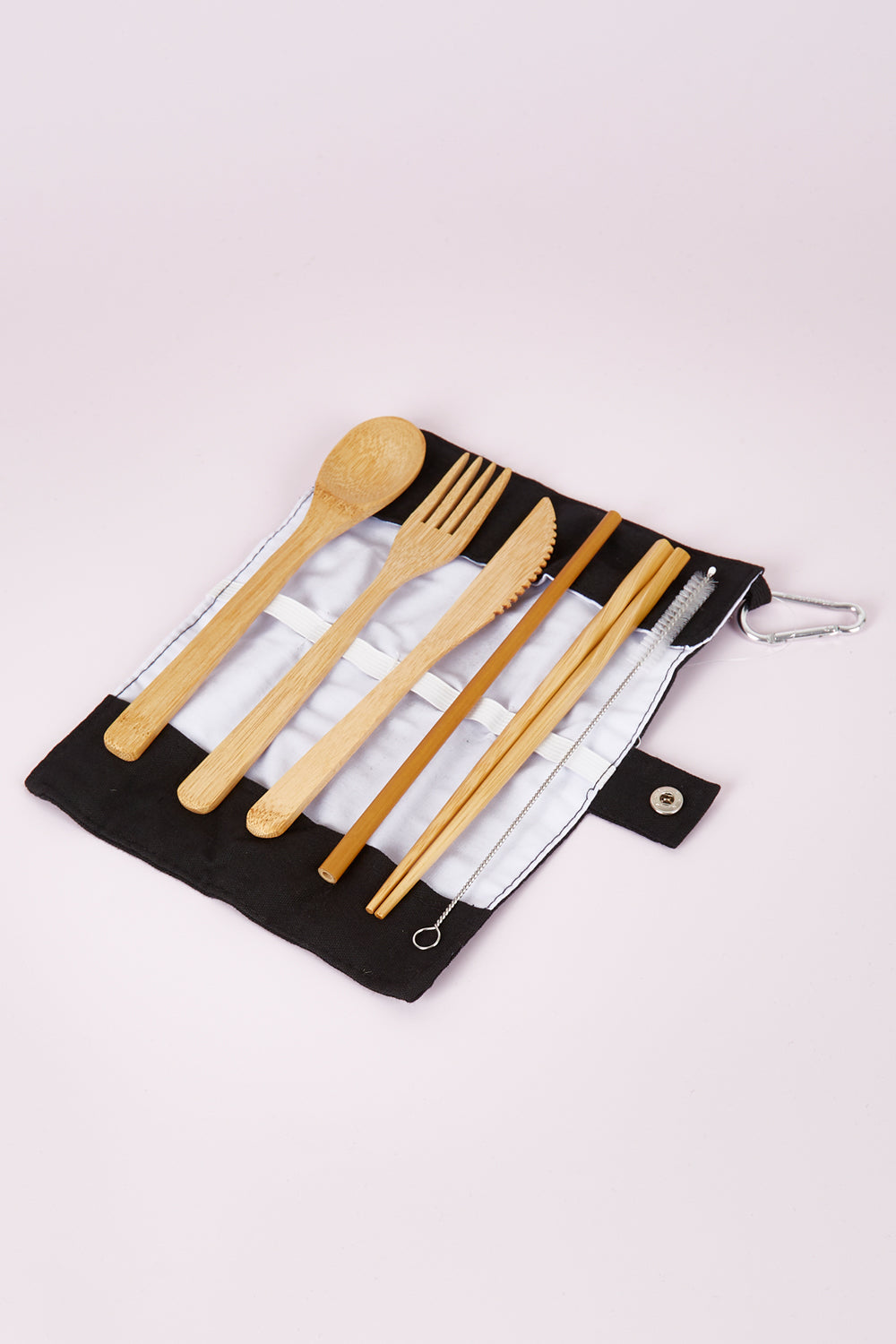 A model wearing size OneSize of the Bamboo Travel Cutlery Set With Carabiner in colour Black (Black), from the front, showing the whole outfit