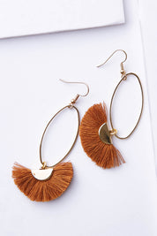 A model wearing size OneSize of the Caprioska Tassel Earrings in colour Tan, from the front, showing the whole outfit
