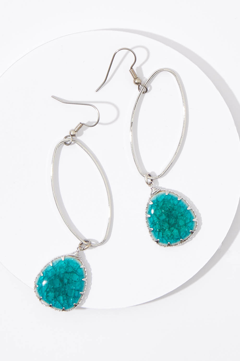A model wearing size OneSize of the Isle Of Capri Drop Earrings in colour Silver (Metallics), from the front, showing the whole outfit