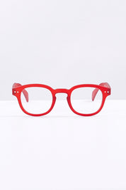 A model wearing size 1 of the Square Reading Glasses in colour Red (Red), from the front, showing the whole outfit