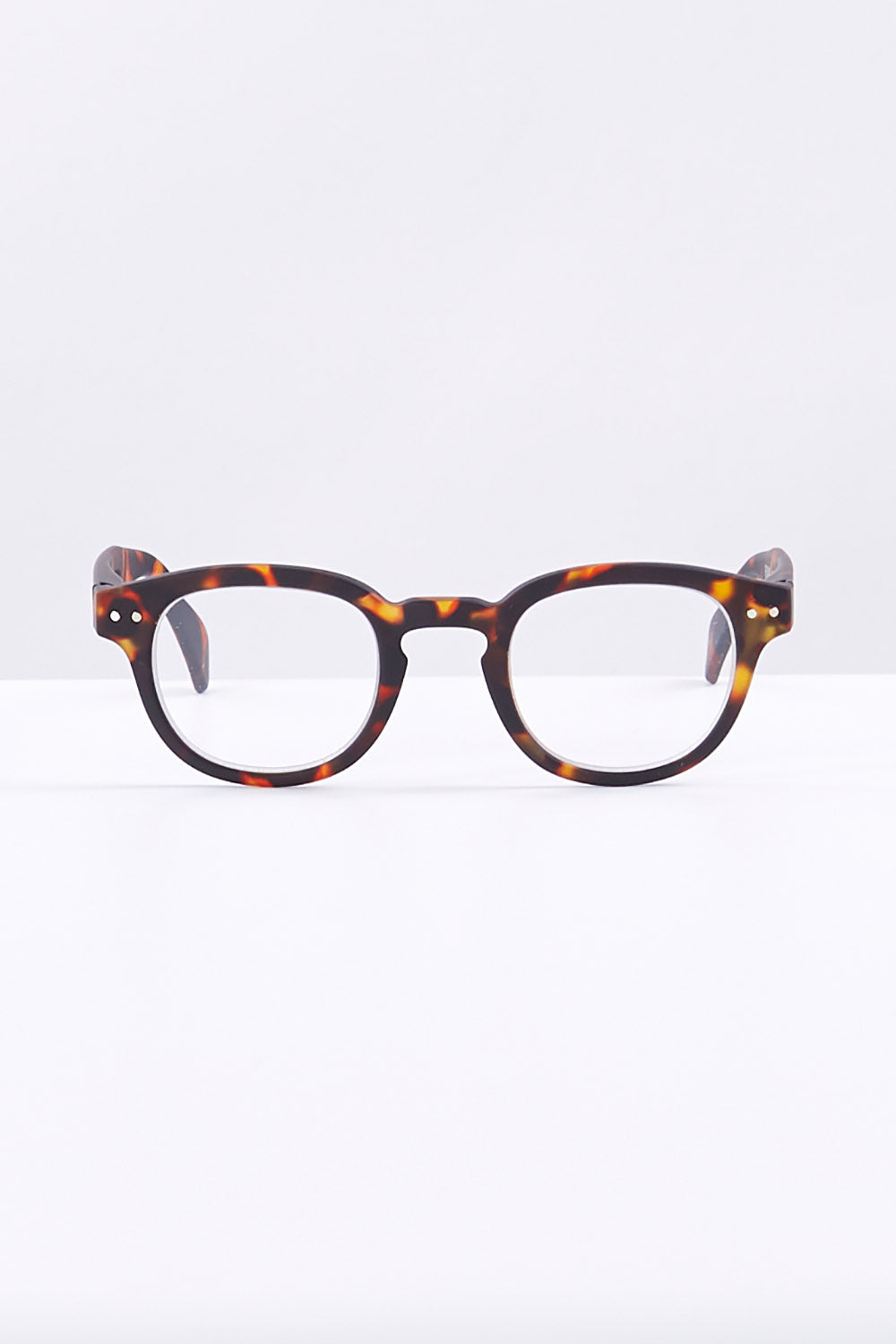 A model wearing size 1 of the Square Reading Glasses in colour Tortoise, from the front, showing the whole outfit