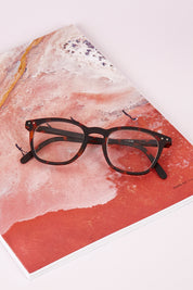 A model wearing size 1 of the Square Reading Glasses in colour Tortoise, from the front, showing the whole outfit