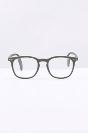 A model wearing size 1 of the E Rectangular Reading Glasses in colour Khakigreen (Green), from the front, showing the whole outfit