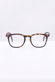 A model wearing size 1 of the E Rectangular Reading Glasses in colour Tortoise, from the front, showing the whole outfit