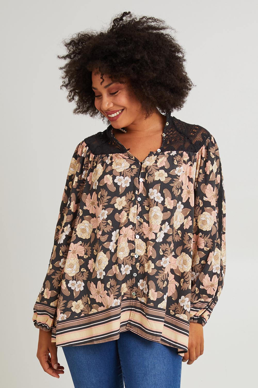 Model Olivia wearing size S of the Florence Blouse in colour Adeleprint (Black), from the front, cropped image