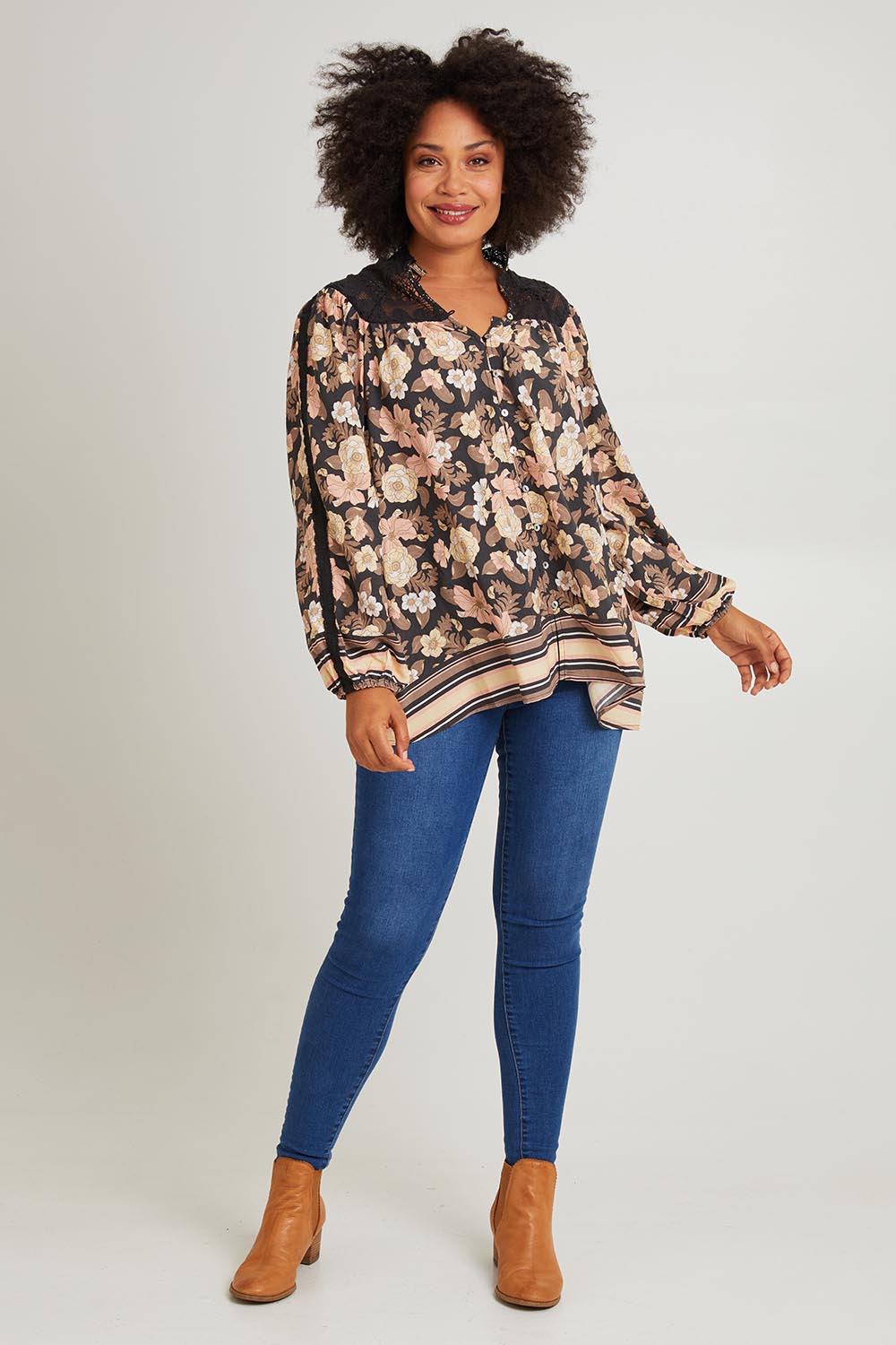 Model Olivia wearing size S of the Florence Blouse in colour Adeleprint (Black), from the front, showing the whole outfit