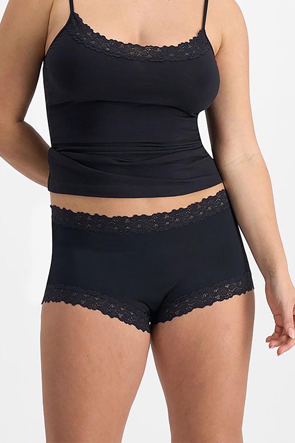 A model wearing the Parisienne Cotton Full Brief in colour Black (Black), from the front, cropped image