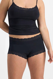 A model wearing the Parisienne Cotton Full Brief in colour Black (Black), from the front, cropped image