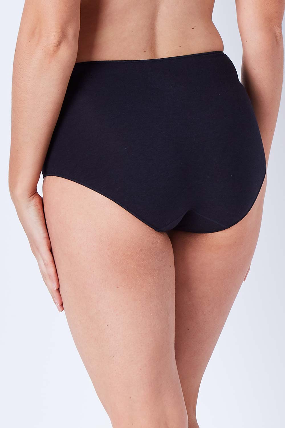Model Phoebe wearing size 10 of the Bamboo Naturals Full Brief in colour Black (Black), from the back