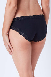 Model Phoebe wearing size 10 of the Parisienne Cotton Bikini in colour Black (Black), from the back