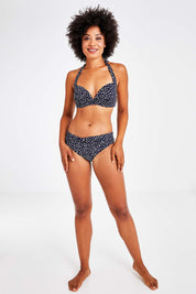 Model Olivia wearing size 10 of the Belle Bikini Bottom in colour Navyspot (Blue), from the front, showing the whole outfit