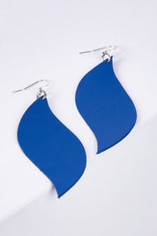 A model wearing size OneSize of the Australian Made Bold Single Leaf Leather Earring in colour Cobalt (Blue), from the front, showing the whole outfit