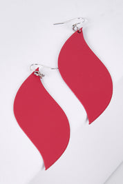 A model wearing size OneSize of the Australian Made Bold Single Leaf Leather Earring in colour Fuschia (Pink), from the front, showing the whole outfit