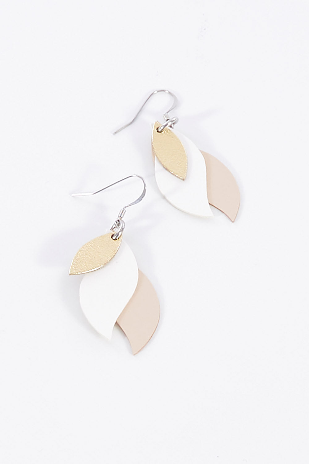 A model wearing size OneSize of the Australian Made Leather Leaf Earring in colour Goldwhite (Metallics), from the front, showing the whole outfit