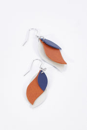 A model wearing size OneSize of the Australian Made Leather Leaf Earring in colour Navybrown, from the front, showing the whole outfit