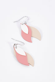 A model wearing size OneSize of the Australian Made Leather Leaf Earring in colour Whitepink (Pink), from the front, showing the whole outfit