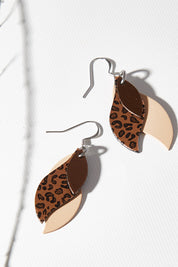 A model wearing size OneSize of the Australian Made Leather Leaf Leopard Earring in colour Broleonat, from the front, showing the whole outfit