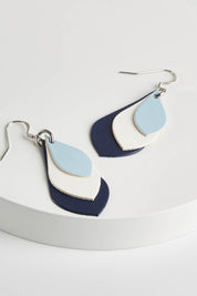 A model wearing size OneSize of the Australian Made Leather Teardrop Earring in colour Bluewhite (Blue), from the front, showing the whole outfit
