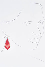 A model wearing size OneSize of the Australian Made Leather Teardrop Earring in colour Pink (Pink), from the front, showing the whole outfit