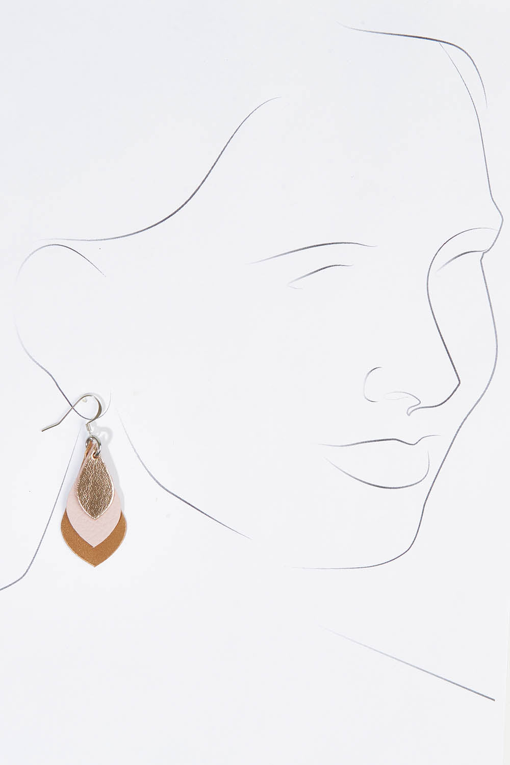 A model wearing size OneSize of the Australian Made Leather Teardrop Earring in colour Softpink (Pink), from the front, showing the whole outfit