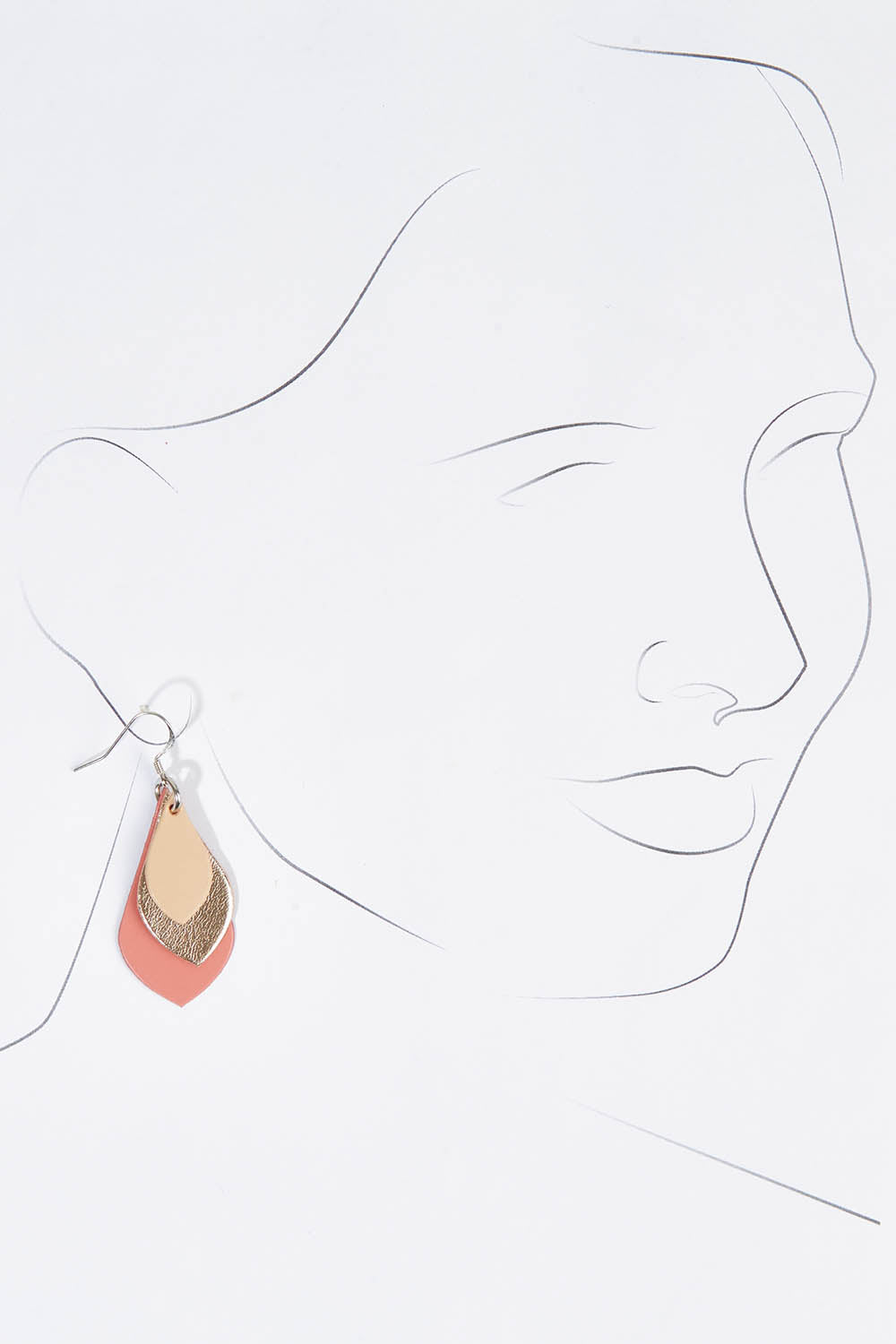 A model wearing size OneSize of the Australian Made Leather Teardrop Earring in colour Warmpink (Pink), from the front, showing the whole outfit