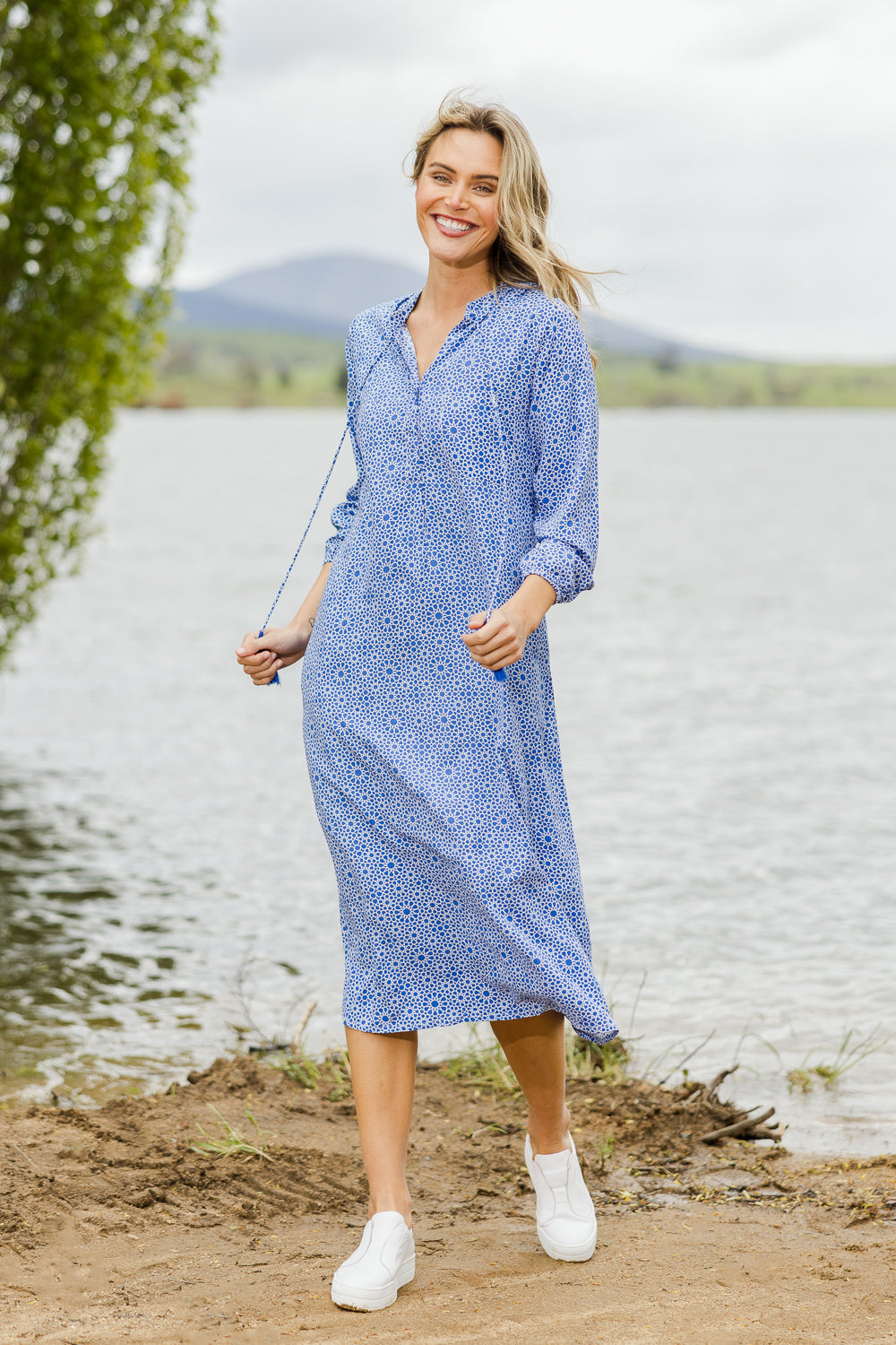 Model Alice wearing size 10 of the Maxi Pop Over Dress in colour Navy (Blue), from the front, showing the whole outfit