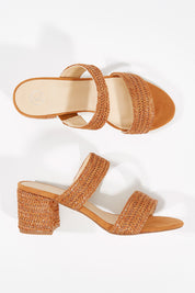 A model wearing size 36 of the Rizzo Woven Heel in colour Tan, from the front, showing the whole outfit