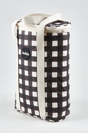 A model wearing the Premium Insulated Wine Cooler Bag in colour Blackcheck (Black), from the front, showing the whole outfit