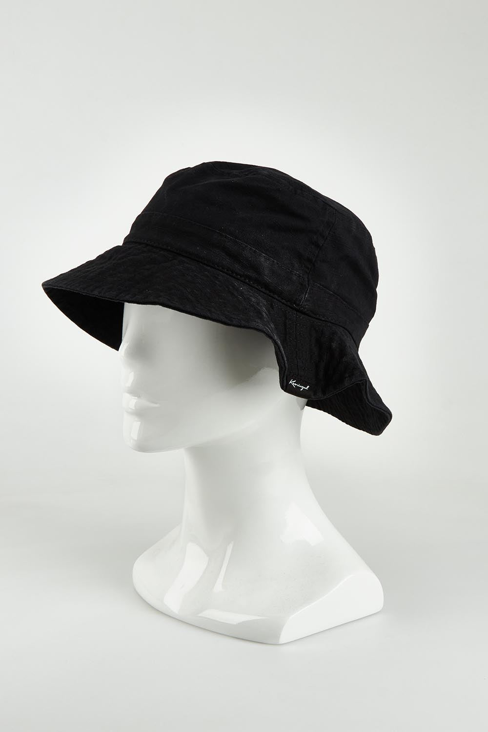 A model wearing the Tullamore Cotton Bucket Hat in colour Black (Black), from the front, showing the whole outfit