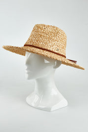 A model wearing the Sawtell Surf Straw Hat in colour Natural, from the front, showing the whole outfit