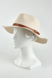 A model wearing the Kallie Merino Wool Safari Hat in colour Nude, from the front, showing the whole outfit