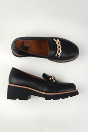 A model wearing size 37 of the Nation Leather Loafer in colour L - Black (Black), from the front, showing the whole outfit