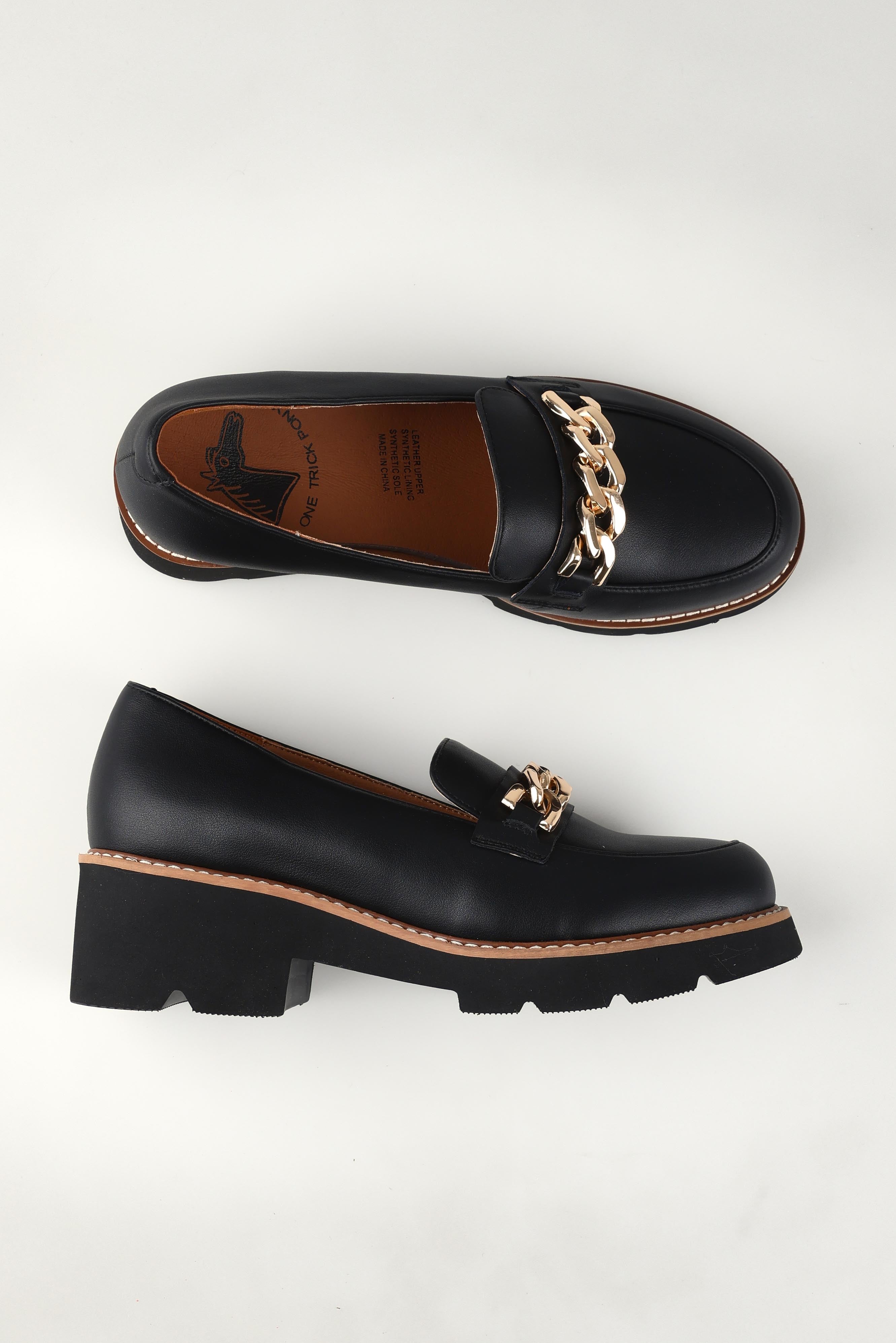 A model wearing size 37 of the Nation Leather Loafer in colour L - Black (Black), from the front, showing the whole outfit