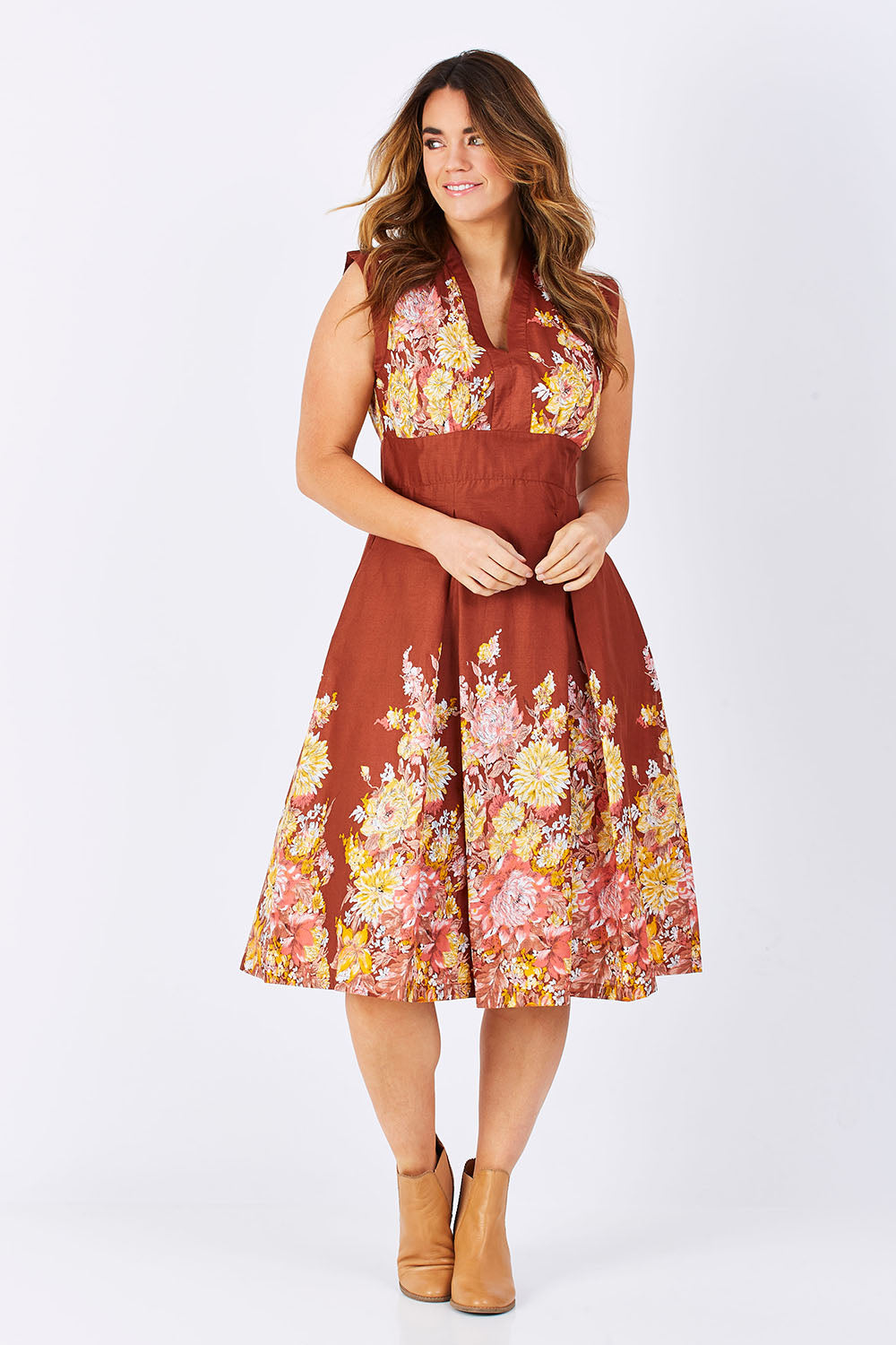 Model Laura wearing size L of the Stephanie Dress in colour Anise, from the front, showing the whole outfit