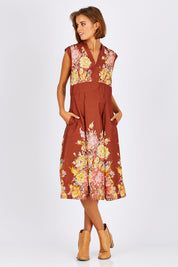 Model Nikki wearing size S of the Stephanie Dress in colour Anise, from the front, showing the whole outfit