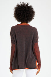 Model Olivia wearing size S of the Plaited Funnel Jumper in colour Amber, from the back