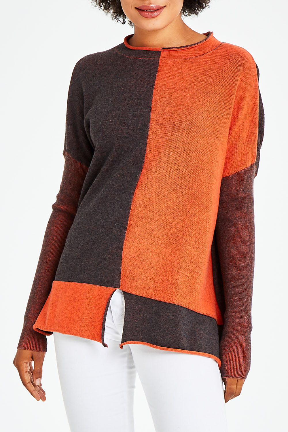 Model Olivia wearing size S of the Plaited Funnel Jumper in colour Amber, from the front, cropped image