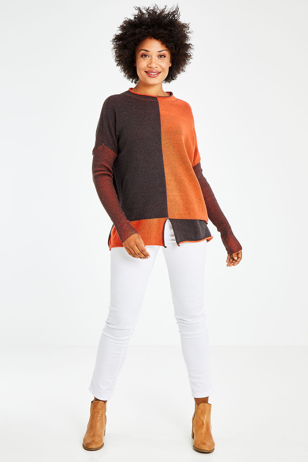 Model Olivia wearing size S of the Plaited Funnel Jumper in colour Amber, from the front, showing the whole outfit