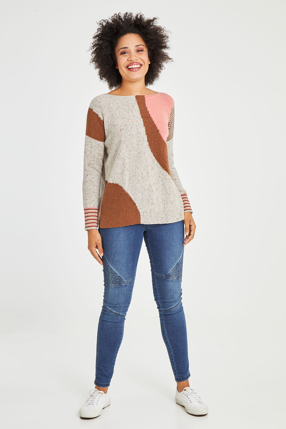 Model Olivia wearing size S of the Whirlwind Jumper in colour Earth, from the front, showing the whole outfit